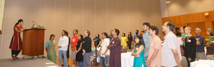 Volunteers and supporters join in singing Is Liye at the close of Utsav 2013, AID Austin’s General Body Meeting and Fundraiser.